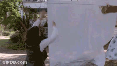Woman Hanging Clothes On Line GIF