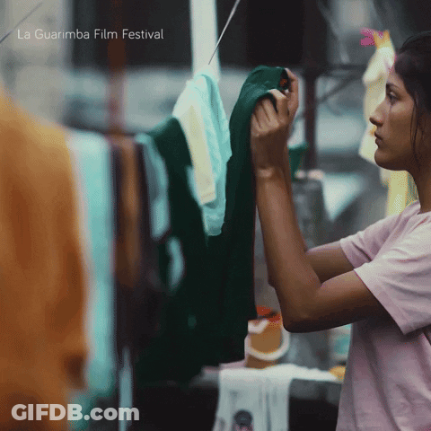 Woman Hanging Clothes With La Guarimba Film Festival GIF
