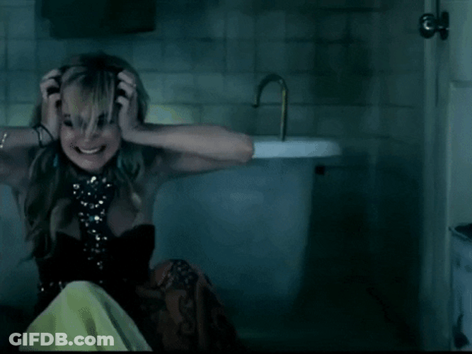 Woman Having Headache In The Bathroom GIF