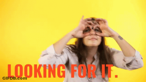 Woman Heart Gesture Looking For It Behind Her GIF
