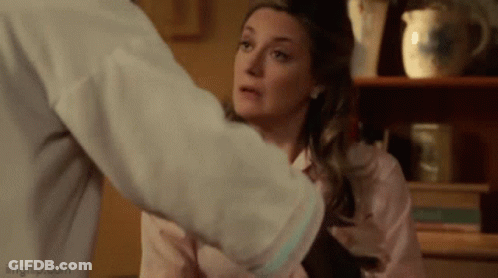 Woman Held By Man In Living Room GIF