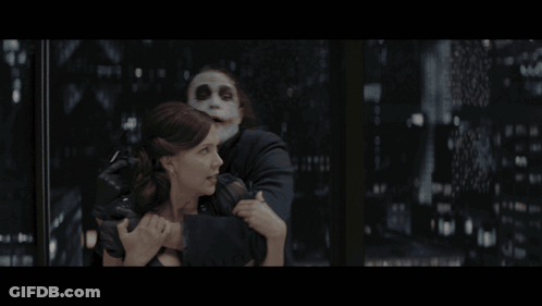 Woman Held By Masked Man Saying Oh Sure GIF