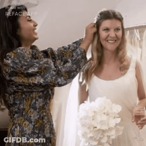 Woman Helping Bride With Wedding Dress GIF