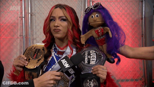 Woman Holding AEW Microphone GIF
