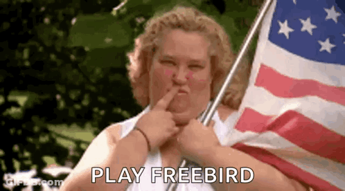 Woman Holding American Flag Saying Play Freebird GIF