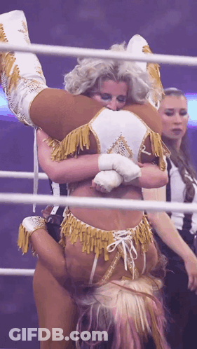 Woman Holding Another Woman Upside Down In Wrestling Ring GIF