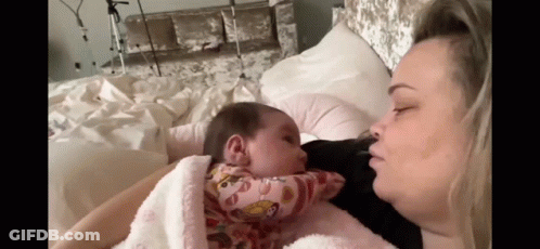Woman Holding Baby And Kissing GIF
