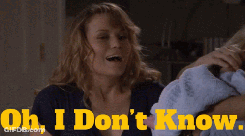 Woman Holding Baby Saying Oh I Don't Know GIF