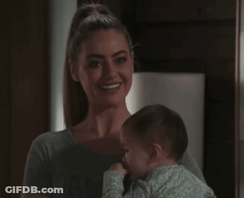 Woman Holding Baby Smiling GIF