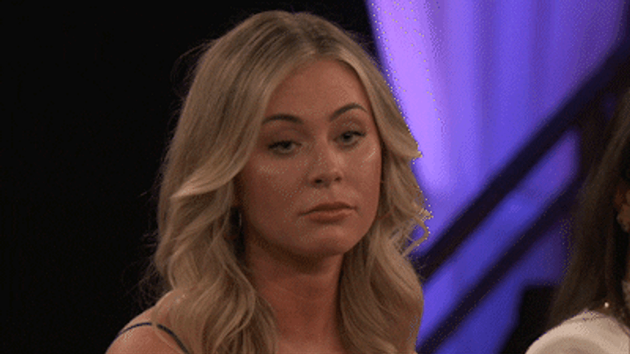 Woman Holding Back On Reacting GIF
