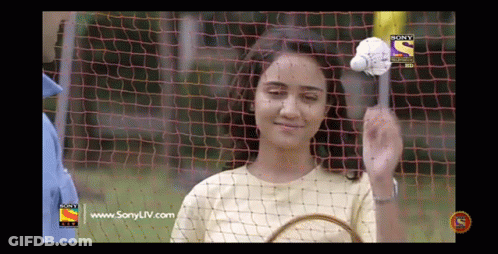 Woman Holding Badminton Racket In Front Of Sony TV GIF
