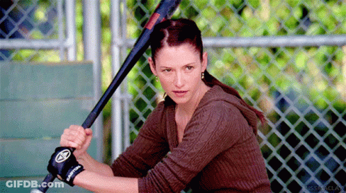 Woman Holding Baseball Bat With Easton Glove GIF