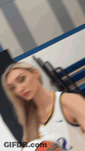 Woman Holding Basketball In Gym GIF