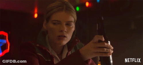 Woman Holding Beer With Netflix Logo GIF