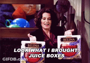 Woman Holding Belina Juice Boxes Saying Look What I Brought GIF