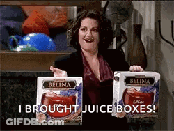 Woman Holding Belina Juice Boxes Says I Brought GIF