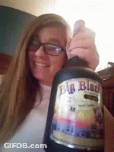 Woman Holding Big Black Beer GIF
