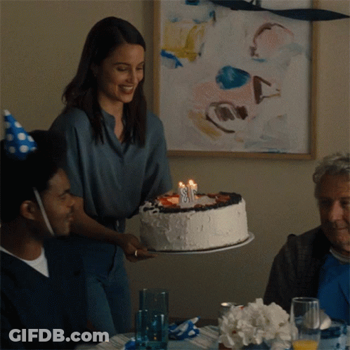 Woman Holding Birthday Cake With Number 8 GIF