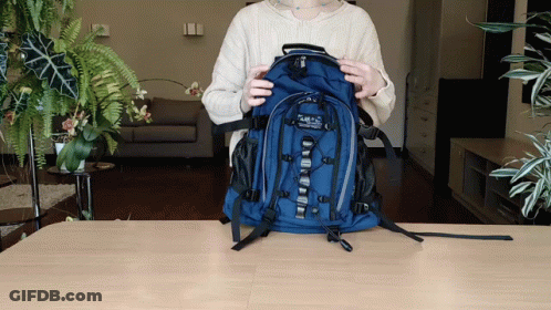 Woman Holding Blue Abercrombie & Fitch Backpack GIF