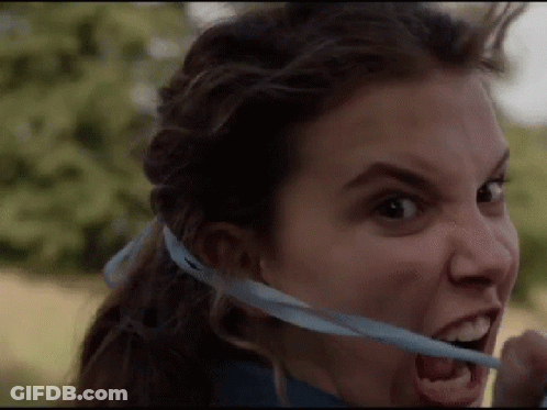 Woman Holding Blue Ribbon In Mouth GIF