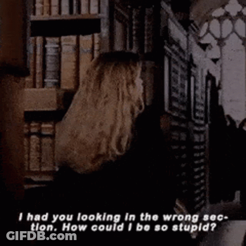Woman Holding Book In Front Of Bookshelf GIF
