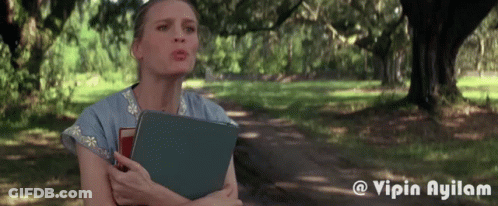 Woman Holding Book In Park GIF