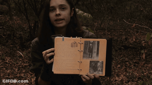 Woman Holding Book That Says That's Right GIF