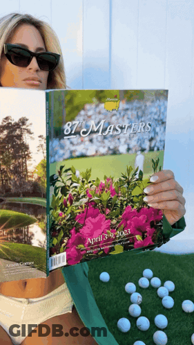 Woman Holding Book Titled 87 Masters GIF
