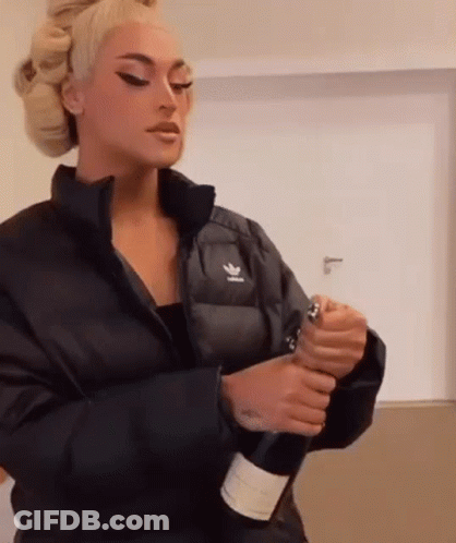 Woman Holding Bottle Of Champagne GIF