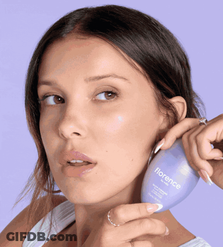 Woman Holding Bottle Of Florence Lotion GIF