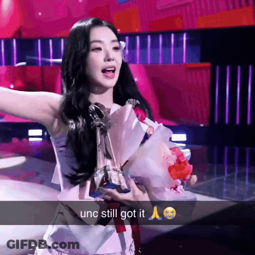 Woman Holding Bouquet And Trophy Unc Still Got It GIF