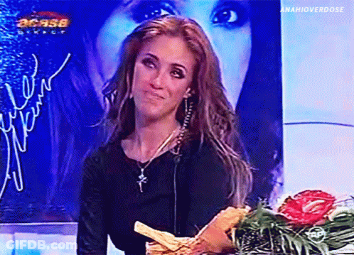 Woman Holding Bouquet Of Flowers At Casa Mexico Sign GIF