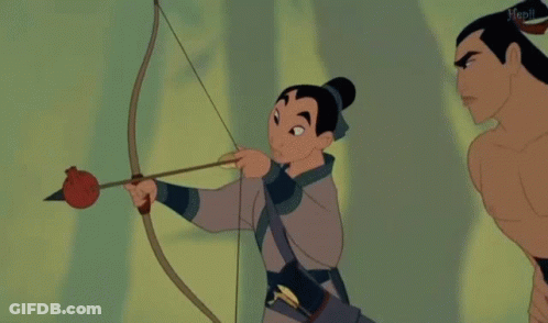Woman Holding Bow And Arrow Next To Shirtless Man GIF