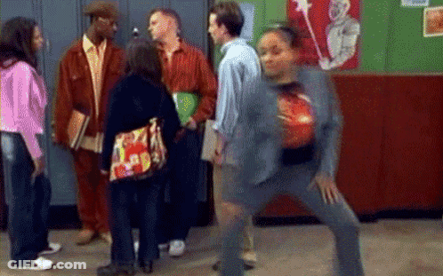 Woman Holding Bowling Ball In Hallway With Group GIF