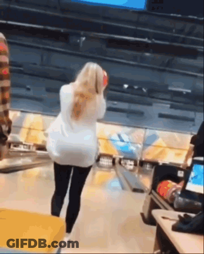 Woman Holding Bowling Ball On Bowling Alley GIF