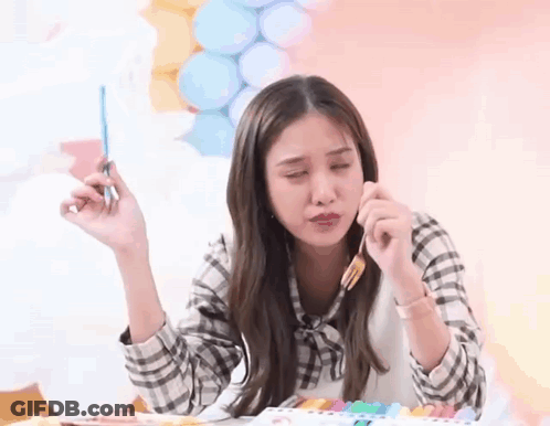 Woman Holding Brush At Table With Balloons GIF