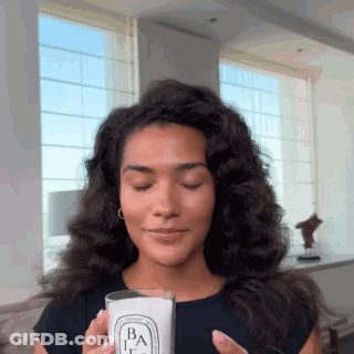 Woman Holding Candle With Letter B GIF