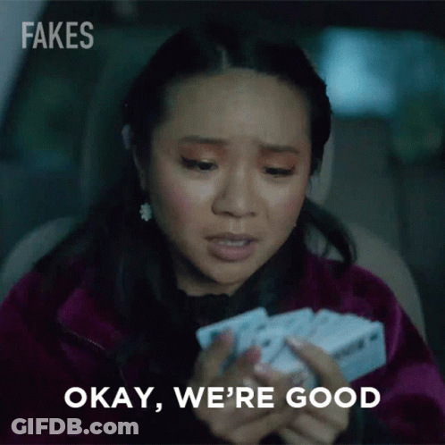 Woman Holding Cards Saying Okay We're Good GIF