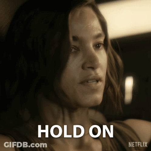 Woman Holding Cell Phone Saying Hold GIF