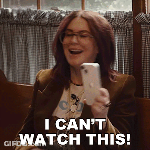 Woman Holding Cell Phone Saying I Can't Watch This GIF