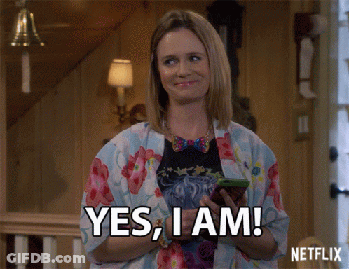 Woman Holding Cell Phone Saying Yes I Am GIF