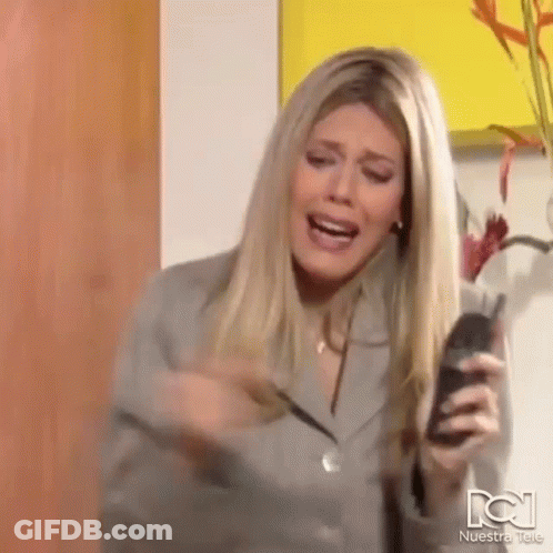 Woman Holding Cell Phone Screaming GIF