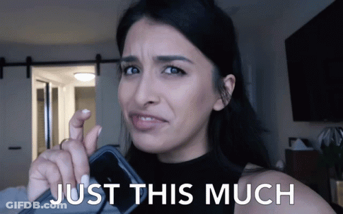 Woman Holding Cell Phone With Just This Much GIF