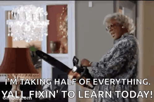 Woman Holding Chainsaw In Front Of Lamp GIF