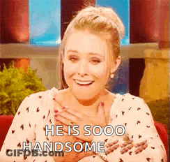 Woman Holding Chest Man Saying He Sooo Handsome GIF
