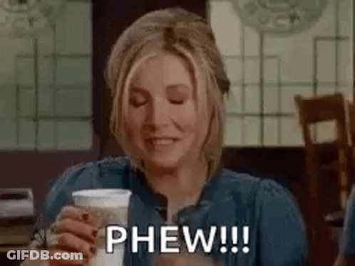 Woman Holding Coffee And Smiling GIF