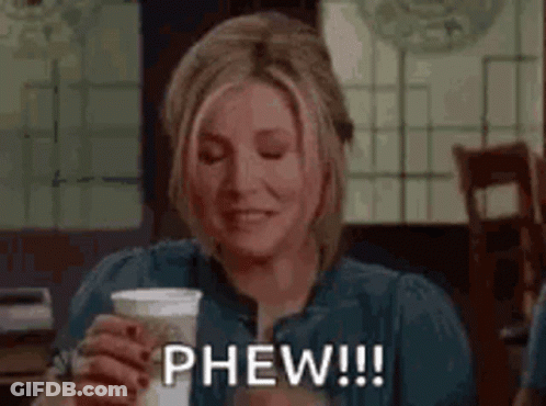Woman Holding Coffee And Smiling GIF