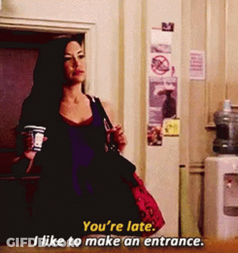 Woman Holding Coffee Says You're Late I Like To Make An Entrance GIF