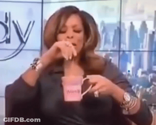 Woman Holding Coffee While Sitting GIF