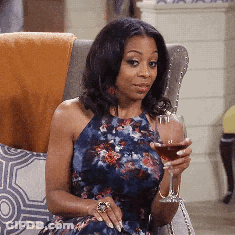 Woman Holding Cup Saying Okay GIF
